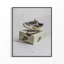 Framed poster showing Air Jordan 1 Travis Scott Reverse Mocha sneaker floating above Nike shoebox with brown swoosh.
