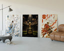 Soccer players as samurai warriors three-panel set displayed beside a brown leather sofa