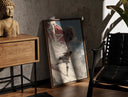 Walnut-framed anime soldier battling colossal titan print leaning against a sunlit rustic brick wall