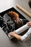 Orange-haired man with cracked skull mask print laid flat in a styling flatlay