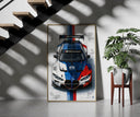BMW M4 GT3 M Power framed print on a staircase entryway wall beside a plant