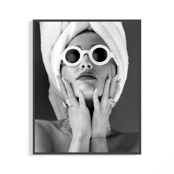 Black and white glamour portrait with white round sunglasses, towel wrap and diamond rings stacked on the hand