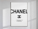 Chanel logo with quote poster in a slim frame on a bright wall with soft window light