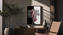 blond man in pink feather coat poster framed above a fluted sideboard beside an olive tree
