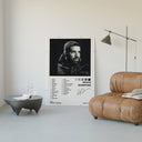 Drake Scorpion poster framed above a tan leather living-room couch