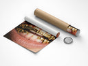 Flat lay of rolled AMG grillz poster with cardboard tube and black cap on white background