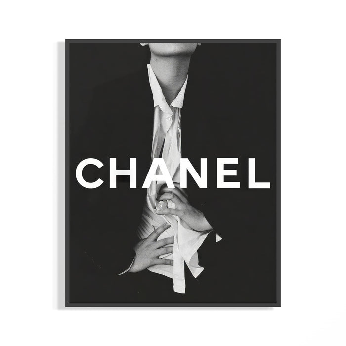 Framed Chanel black and white fashion poster with bold white CHANEL typography and an editorial figure in an open shirt