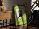 Walnut-framed Man covering face album cover print leaning against a sunlit rustic brick wall