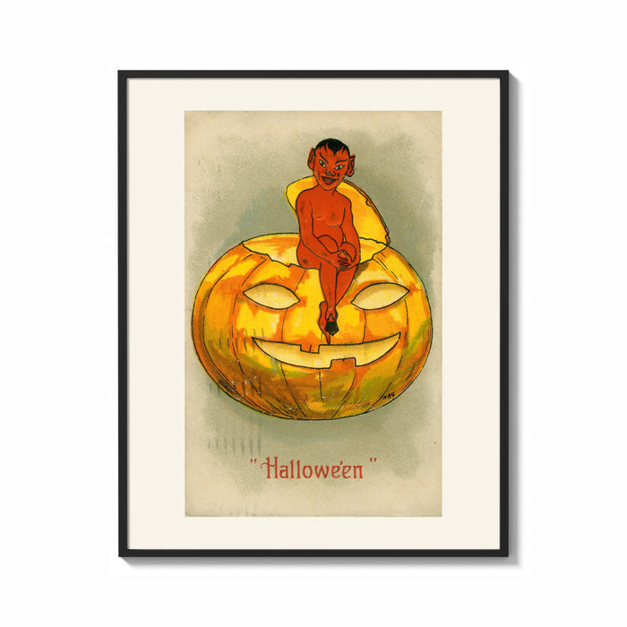 Framed Red devil sitting on jack-o-lantern print shown as a bold statement piece on a clean gallery wall