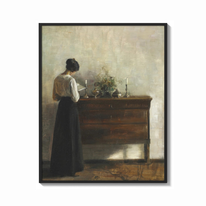 Framed woman reading at a dresser in a quiet interior vintage art print print shown as a bold statement piece on a clean…