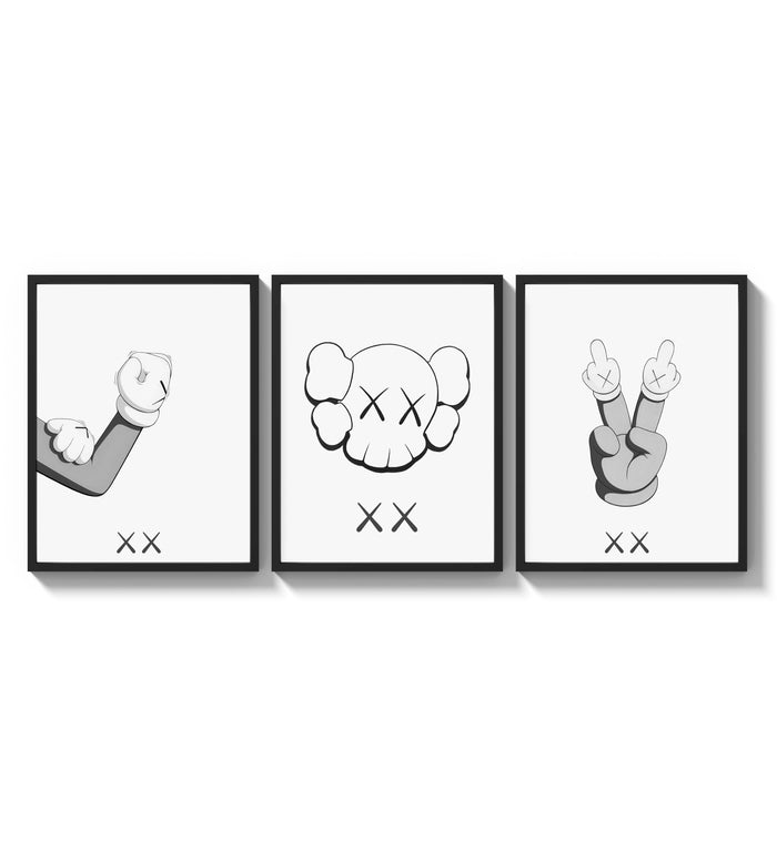 KAWS cartoon hands and skull face three-panel set arranged as a triptych on a bright gallery wall
