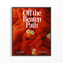 KAWS-inspired red plush character poster with Off the Beaten Path typography in thin dark frame