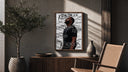 Man looking upward in profile poster framed above a fluted sideboard beside an olive tree