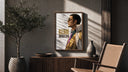 Man in profile with sunglasses poster framed above a fluted sideboard beside an olive tree