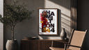 Lewis Hamilton F1 driver portrait poster framed above a fluted sideboard beside an olive tree