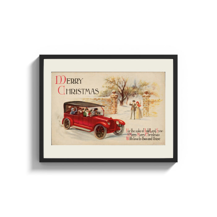Framed Vintage red touring car in snow print shown as a wide statement piece on a clean white wall