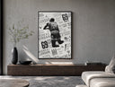 Michael Jordan slam dunk poster framed above a wood console in a concrete-wall living room