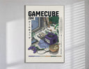Purple GameCube console with controller poster in a slim frame on a bright wall with soft window light
