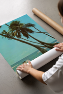 Beach scene with palm trees and surfers print laid flat in a styling flatlay