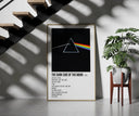 Pink Floyd Dark Side of the Moon Prism framed print on a staircase entryway wall beside a plant