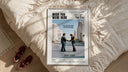 Pink Floyd Wish You Were Here Burning Handshake framed print styled on a bed with sneakers alongside