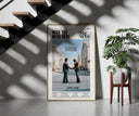 Pink Floyd Wish You Were Here Burning Handshake framed print on a staircase entryway wall beside a plant