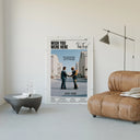 Pink Floyd Wish You Were Here Burning Handshake poster framed above a tan leather living-room couch