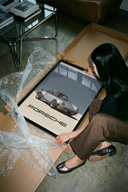 Porsche 911 Turbo Classic Silver print highlighting silver metallic paint arranged beside brown cardboard shipping tube
