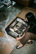 Porsche 911 Classic White Industrial Loft unframed poster print leaning against a cardboard tube on a surface