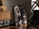 Walnut-framed Red-Haired Shanks manga collage print leaning against a sunlit rustic brick wall
