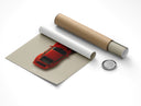 Rolled Porsche 911 Carrera RS 1995 classic car poster next to its cardboard tube packaging