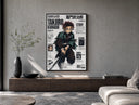 Anime boy wielding katana sword poster framed above a wood console in a concrete-wall living room
