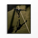 Tennis Player Overhead Serve Shadow poster in black frame showing aerial view of tennis player mid-serve.