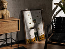 Walnut-framed Man with bees on face, back turned print leaning against a sunlit rustic brick wall
