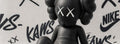 Sitting KAWS companion with Nike tags — KAWS poster detail