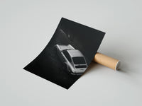 Rolled Silver Porsche 911 parked in alley poster beside its crush-resistant kraft shipping tube