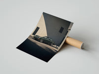 Rolled Vintage green Porsche 911 coupe poster beside its crush-resistant kraft shipping tube