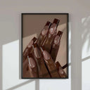 Detailed view of beautifully manicured nails showcasing various shades and designs.