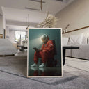 Astronaut Wall Art Print by Haus of Prints, illustrating an astronaut in orange, seated quietly with a device, emulating a cosmic aura.