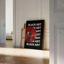 Black Art x The Strokes Vinyl Poster displayed in a modern living room setting with a red vinyl record.