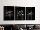 Black Sneaker Wall Art Set of 3, displaying unique sneaker designs with reflective surfaces on a dark background.