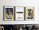KAWS contemporary wall art set of 3 printable posters in black and yellow tones, framed digital art for living room decor, Haus of Prints.
