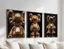 Hypebeast Gold Posters Set of 3 showcasing three shiny KAWS figures in a chic decor setting.
