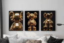 Hypebeast Gold Posters Set of 3 featuring KAWS art pieces elegantly framed on a modern wall.