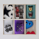 Art with a KAWS-inspired design combining fun character forms and abstract elements in chic frames.