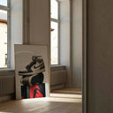 Elegant wall art of trendy sneakers resting on a prominent red and black box.