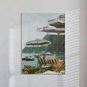 Framed Luxury Seascape Travel Poster featuring beach umbrellas and coastal view, printable digital wall art by Haus of Prints.