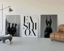 Bold black-and-white poster of three Doberman dogs, symbolizing strength and elegance.