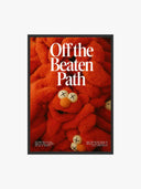 Off the Beaten Path – KAWS-Inspired Plush Art Print featuring vibrant orange plush with cartoonish eyes and nose.