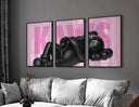KAWS poster layout showing black figure on a pink backdrop, featuring the full "KAWS" text graphic arrangement.